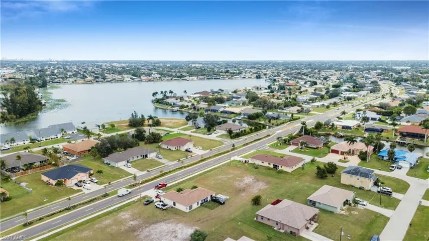 Drone / aerial view featuring a water view and a residential view