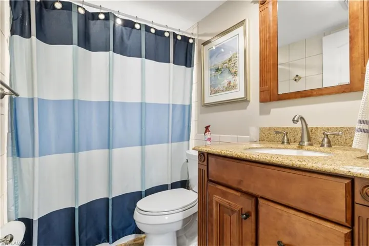 Bathroom featuring oversized vanity and toilet