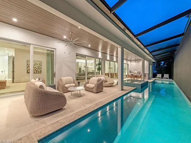 View of pool featuring an outdoor living space, a lanai, ceiling fan, and a patio