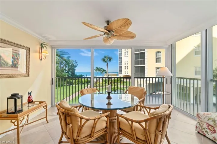 The spacious lanai is an entertainer’s dream, offering the option to close the glass sliders for an air-conditioned sunroom or open them up to enjoy the sound of the surf