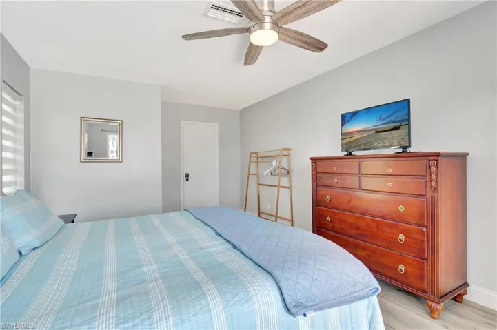 Bedroom featuring light hardwood / wood-style flooring and ceiling fan