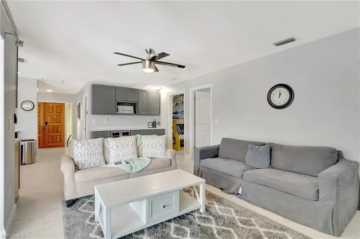 Living room featuring ceiling fan
