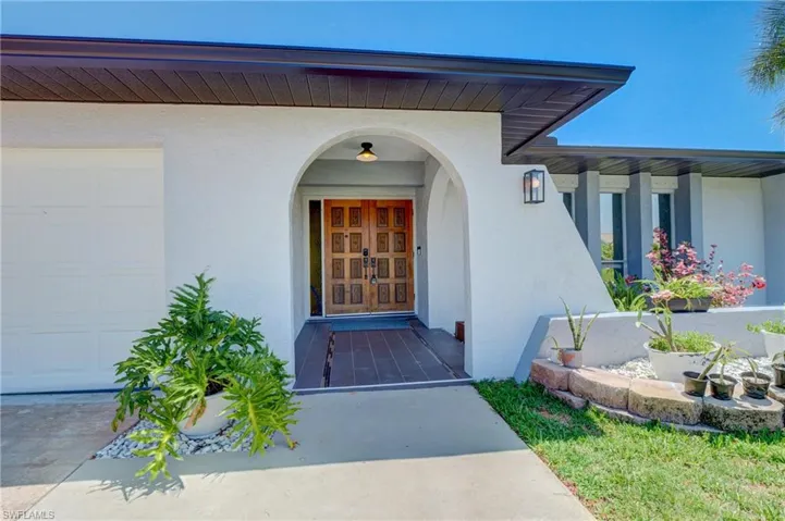 Property entrance with a garage