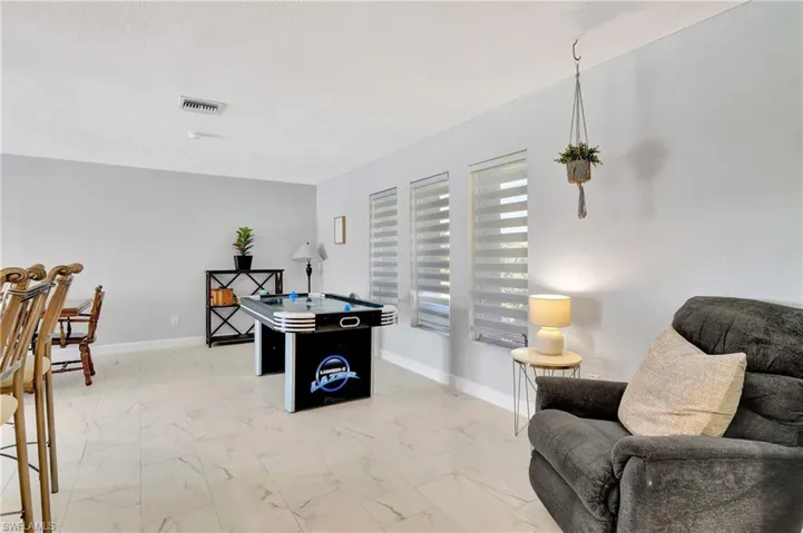Game room featuring light tile patterned floors