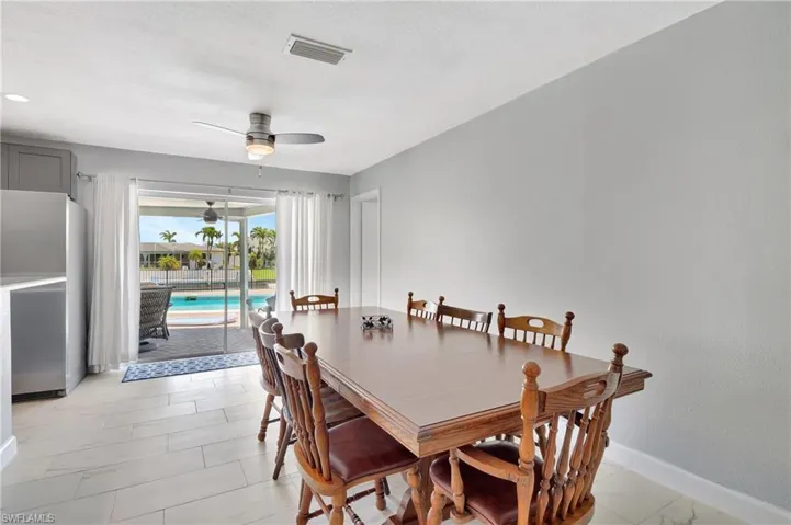 Tiled dining area with ceiling fan