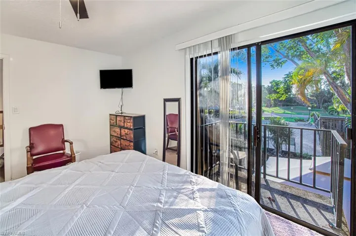 Bedroom with access to outside and a ceiling fan