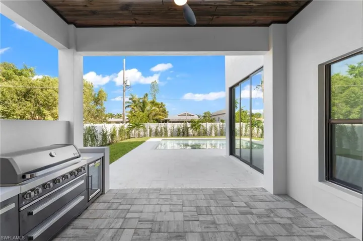Covered Pool deck area with outdoor kitchen