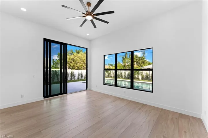 1st Floor Primary Bedroom with pool and spa views