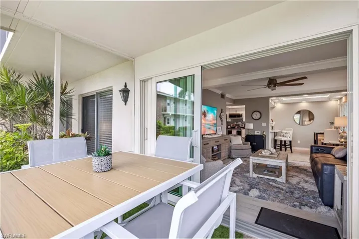 Screened lanai offering covered outdoor dining and seamless indoor-outdoor living.