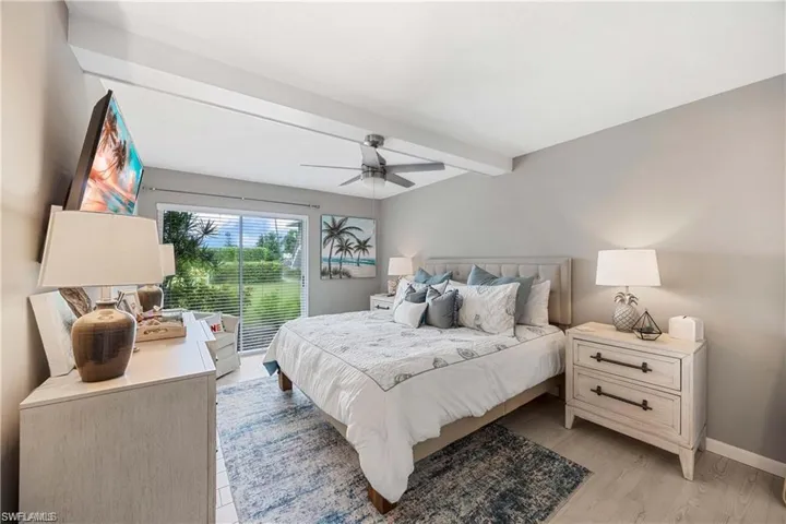 Primary bedroom offering generous space, neutral finishes, and a relaxing coastal design.