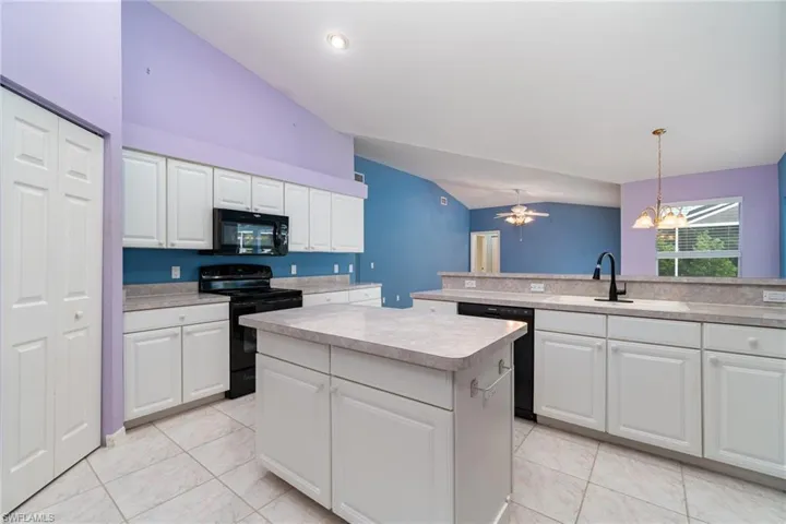 White cabinetry & volume ceilings