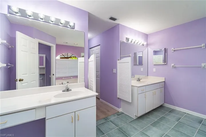 Bathroom featuring dual vanities