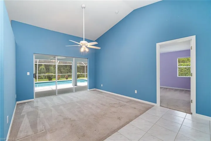 Volume ceilings with triple sliders to lanai and pool area
