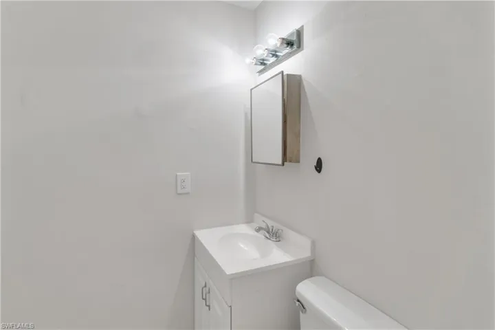 Bathroom featuring vanity and toilet