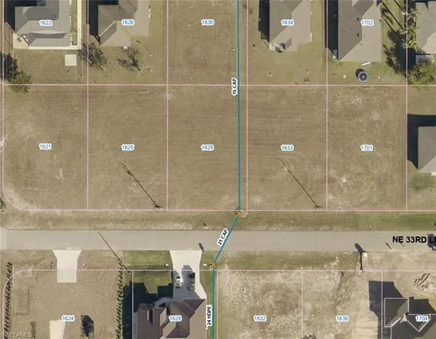 Aerial overview of property's location featuring property parcel outlined