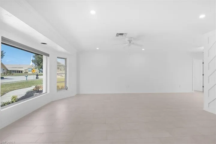 Unfurnished room featuring a ceiling fan and recessed lighting
