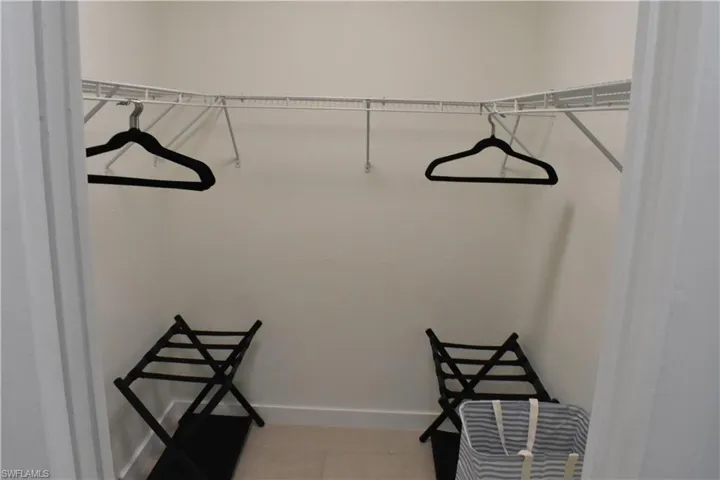 Walk in closet featuring light tile patterned floors