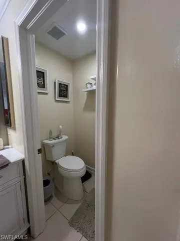 Bathroom featuring light tile patterned floors and vanity