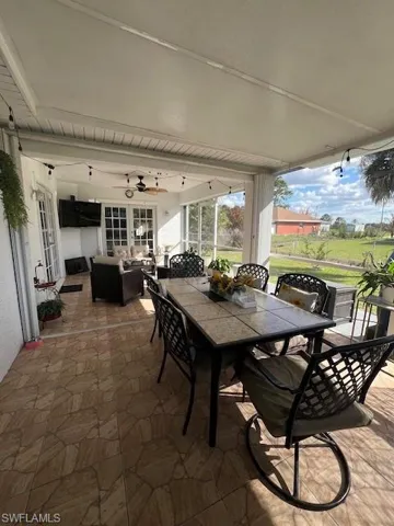 View of patio / terrace featuring a ceiling fan and outdoor lounge area