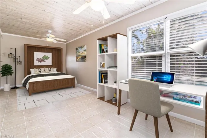 Tiled bedroom featuring wood ceiling, ceiling fan, crown molding, and vaulted ceiling - Virtually Staged