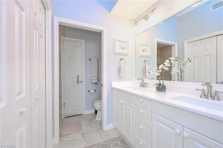 Updated master bath with beautiful quartz countertops, faucets and updated lighting