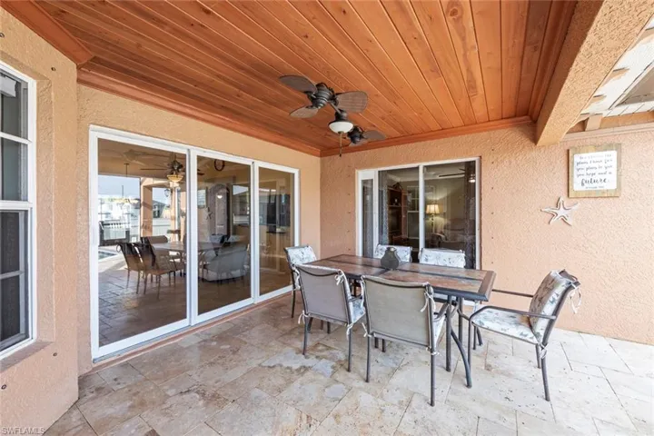 View of patio / terrace featuring outdoor dining space and ceiling fan
