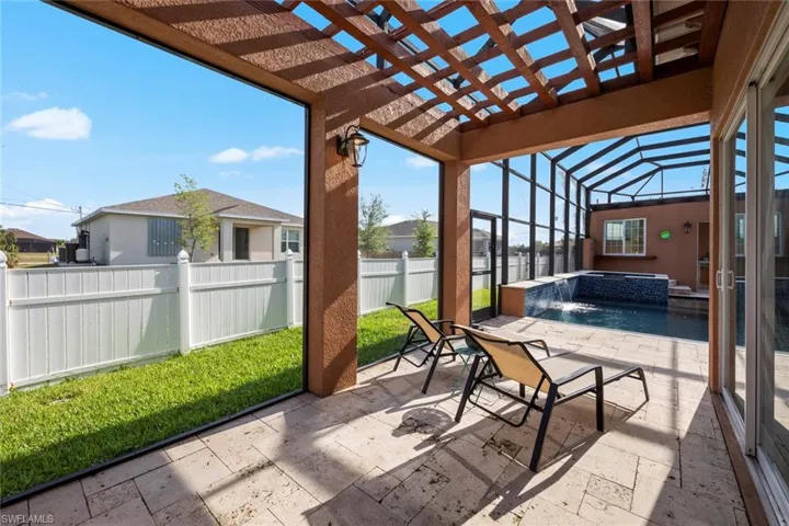 View of patio / terrace with a fenced in pool, a pergola, an in ground hot tub, glass enclosure, and fence