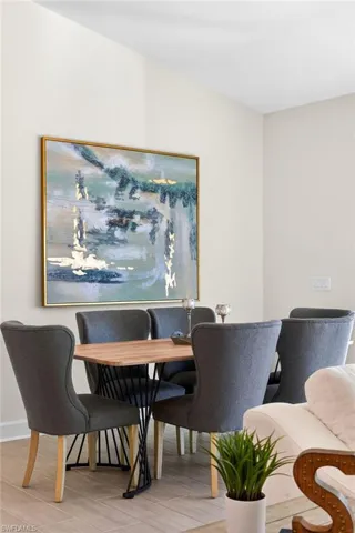 Dining room with wood finished floors and baseboards