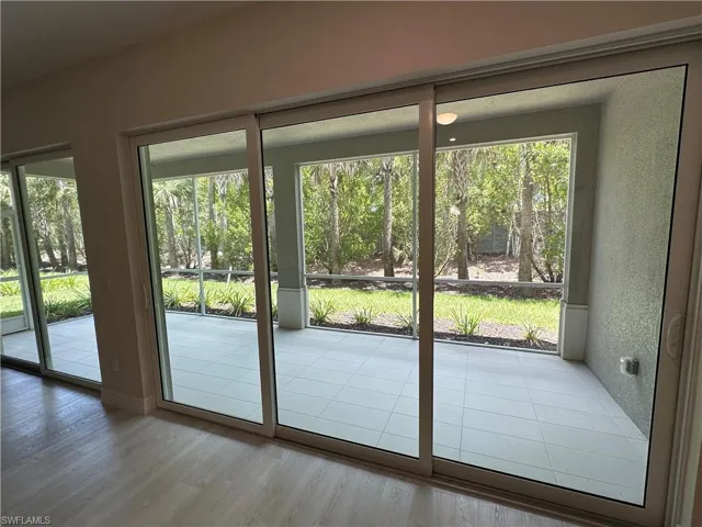 Doorway to outside featuring wood finished floors