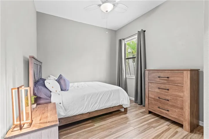 Bedroom with light wood-style flooring and ceiling fan