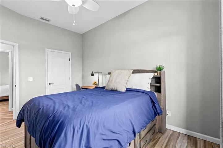 Bedroom featuring light wood finished floors and a ceiling fan