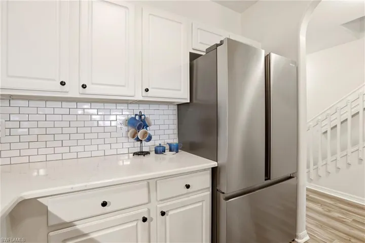 Tile Backsplash, Quartz Countertops , Stainless Appliances