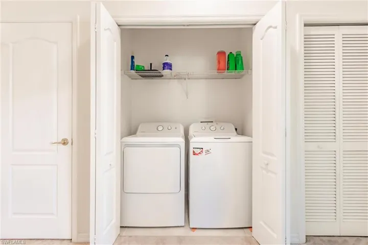 Laundry area featuring separate washer and dryer