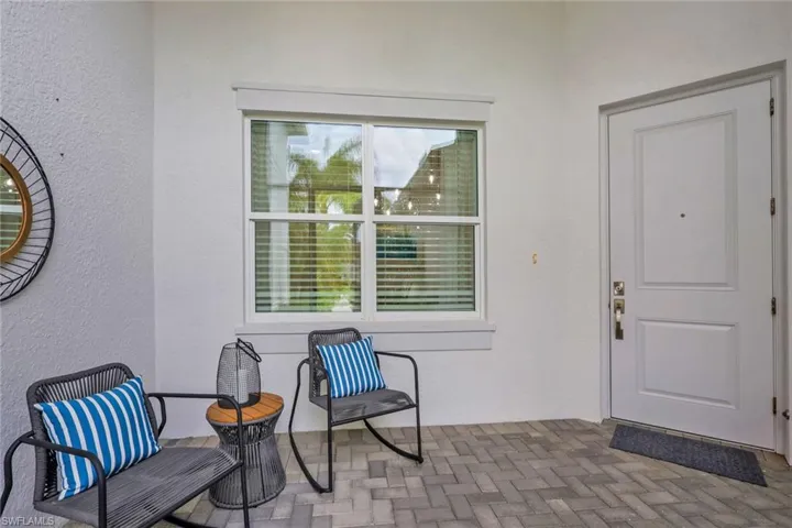 Covered entry with gray paver flooring