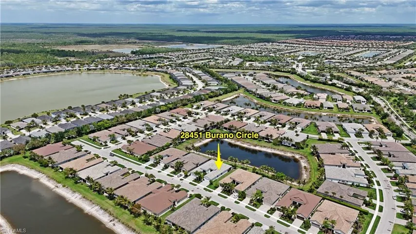 Aerial perspective showcasing a residential community with numerous single-story homes