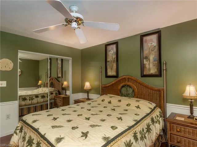 Primary bedroom featuring ceiling fan.