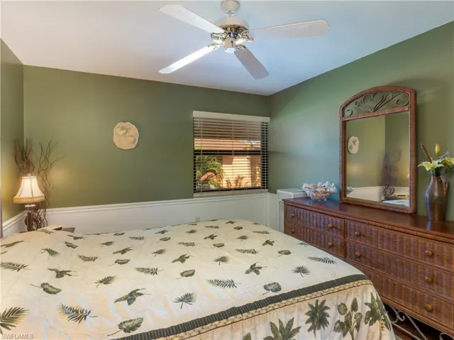 Primary bedroom featuring ceiling fan.