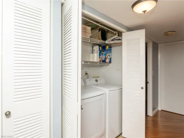 Laundry closet featuring in-unit washer and dryer.