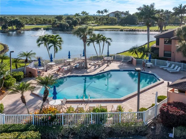 View of the property's community pool overlooking the pond and golf course.