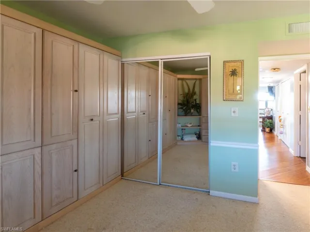 Bedroom featuring mirrored closet.