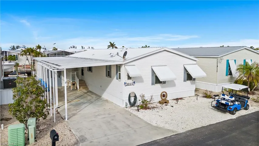 Front of property featuring a carport