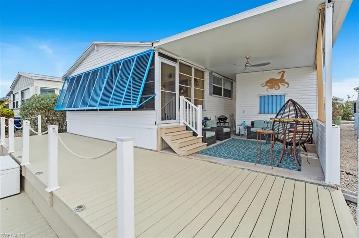 Deck with a patio, ceiling fan, and a patio area
