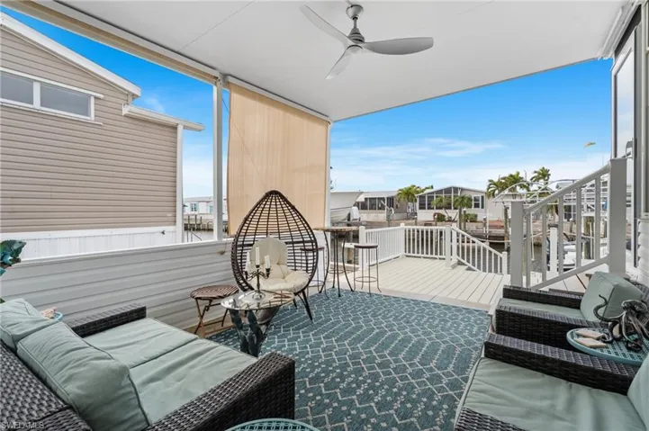 Outdoor patio featuring a view of the canal and dock