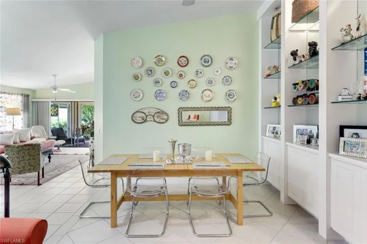 Dining space featuring a ceiling fan and light tile patterned floors
