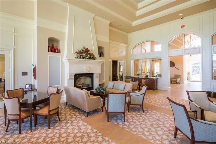 Lobby with a towering ceiling and crown molding