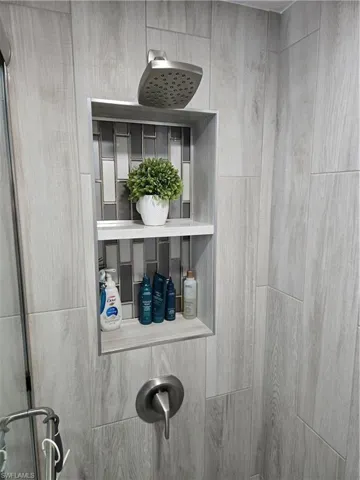 Room details featuring a shower