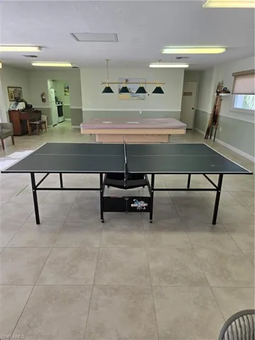Recreation room featuring light tile patterned flooring