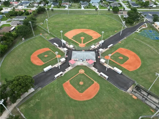 Recreational park featuring four baseball diamonds with red clay infields and green outfields