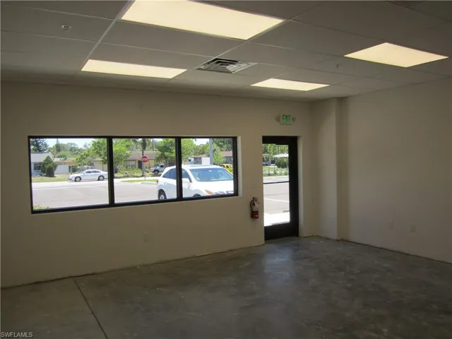 Empty room with a drop ceiling