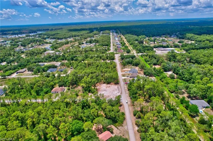 Aerial overview of property's location with a forest